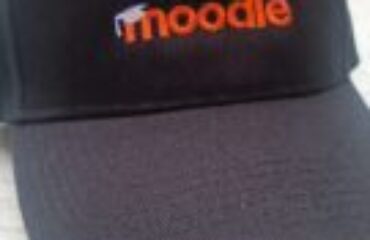 Black cap with Moodle logo in orange